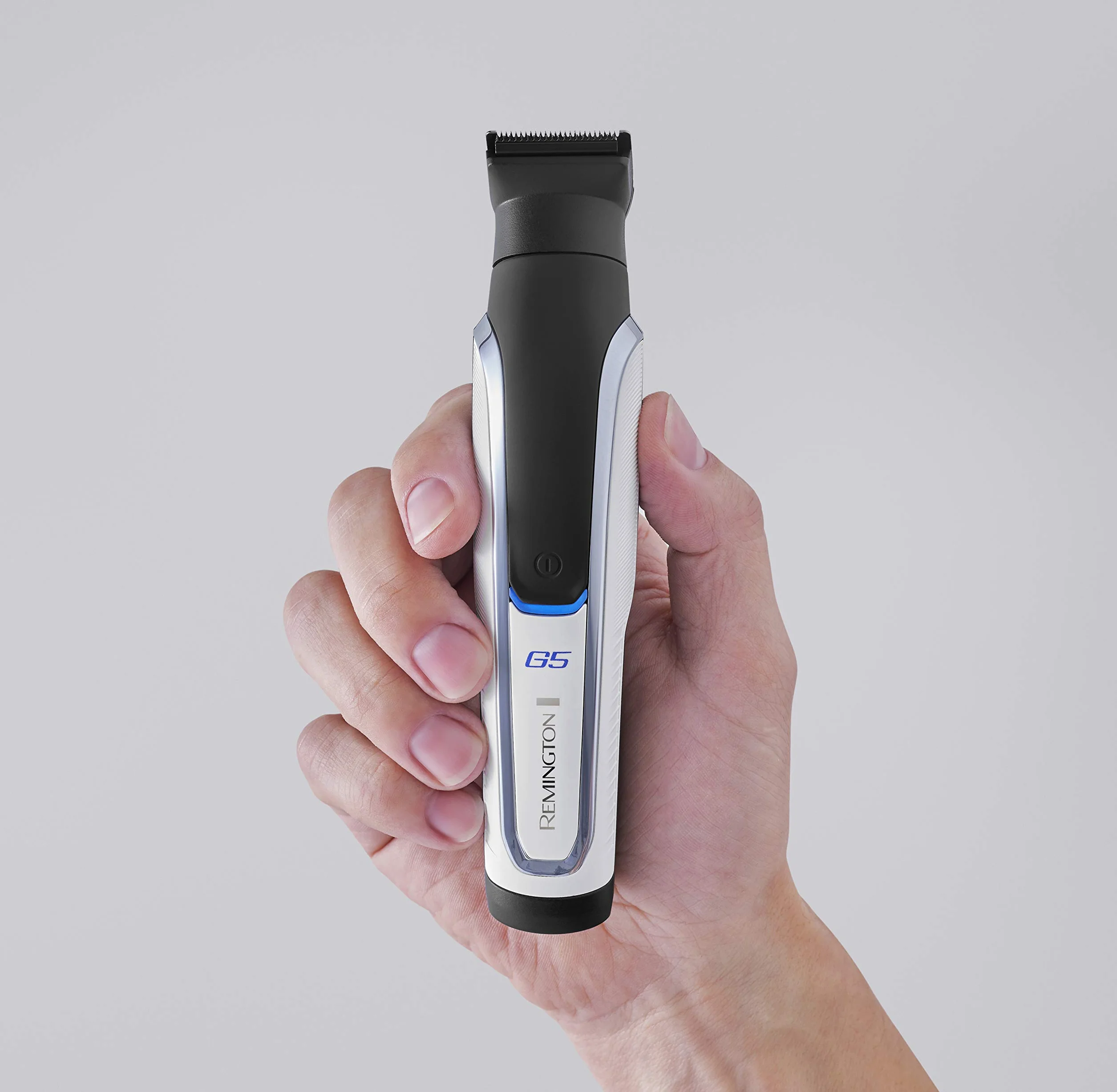 Remington Rasoio Elettrico Multiuso - Rifinitore per il corpo, Regolabarba, Tagliacapelli, Taglia peli naso e orecchie - 9 testine-pettini, al Litio, Regolabarba, Multigroomer, PG5000