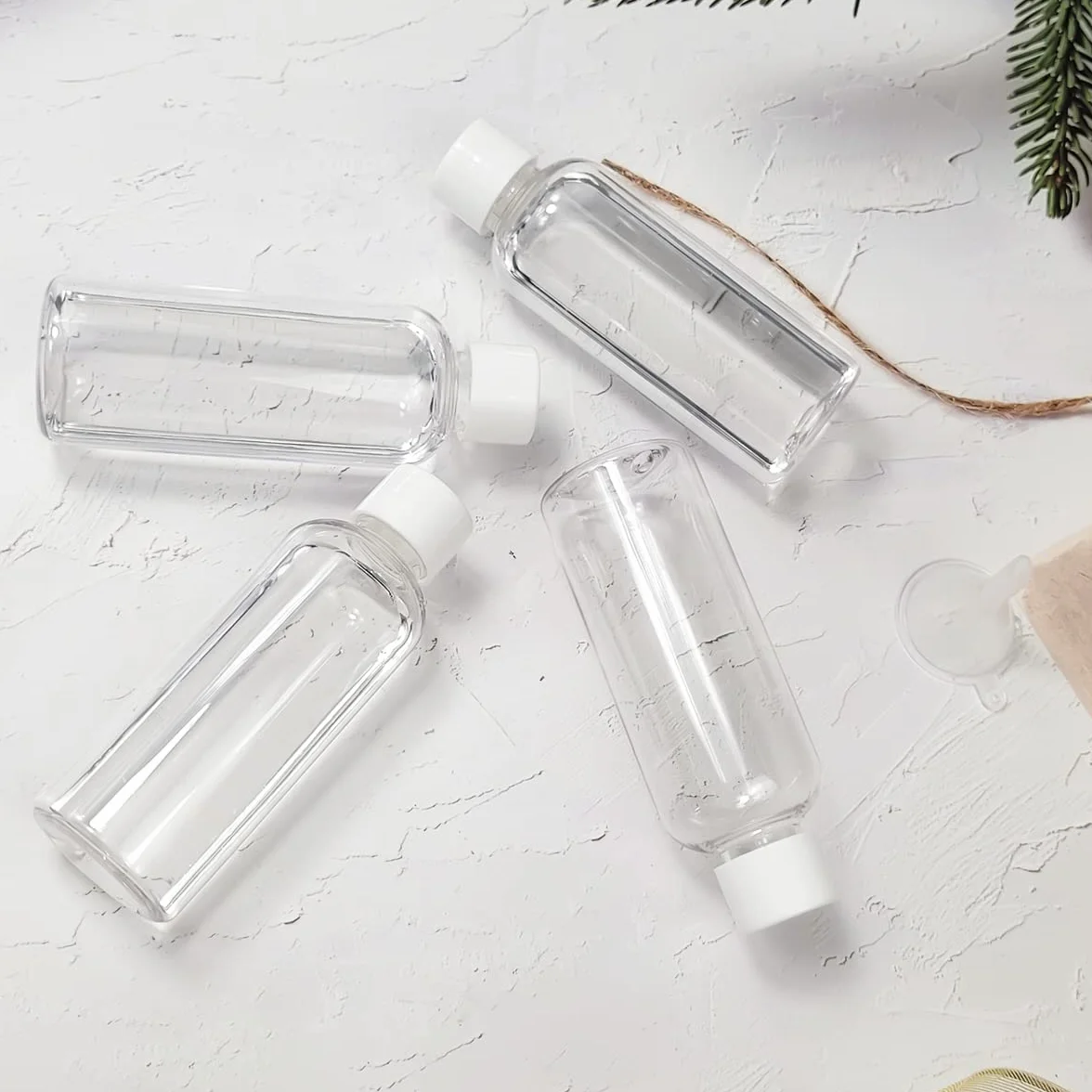 Bottiglie da viaggio da 4 pezzi, 100 ml Bottiglie da viaggio in plastica vuote ricaricabili con coperchi a vite per articoli da toeletta, sapone, shampoo e balsamo